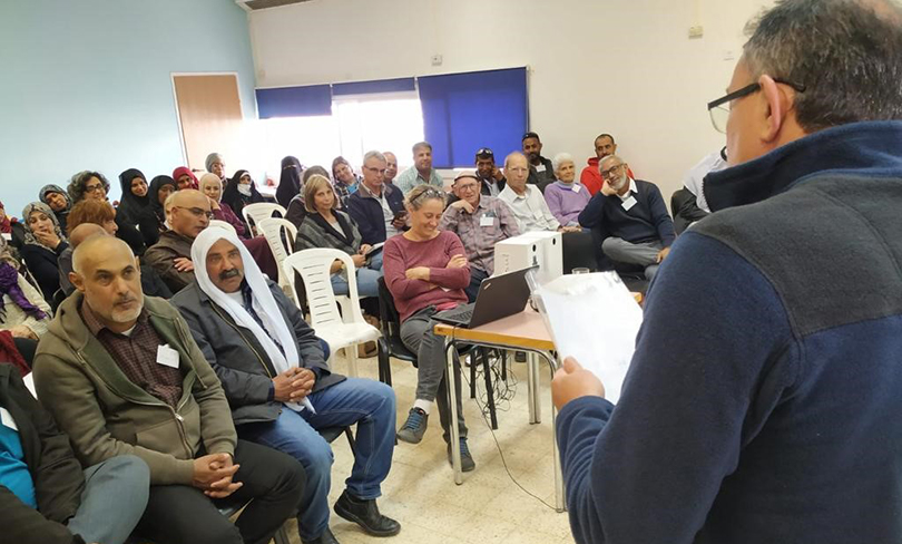 People attend a meeting in the Negev