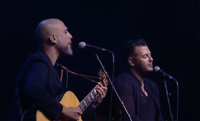 Two people singing at the Israeli-Palestinian Memorial Ceremony