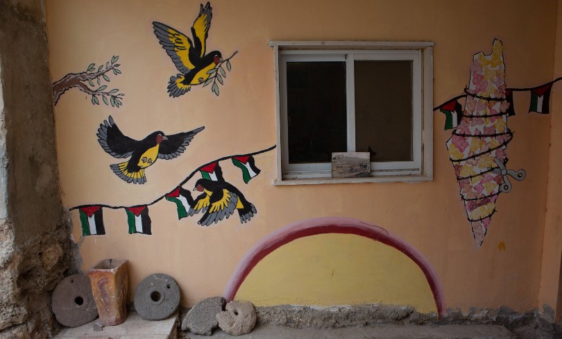 A wall with Palestinian national symbols in Massafer Yatta