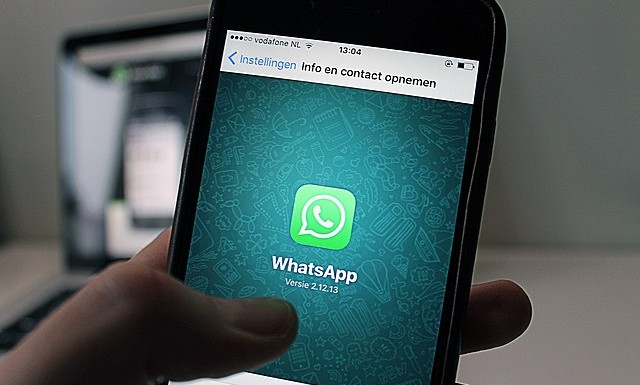 A mobile phone with whatsapp opened
