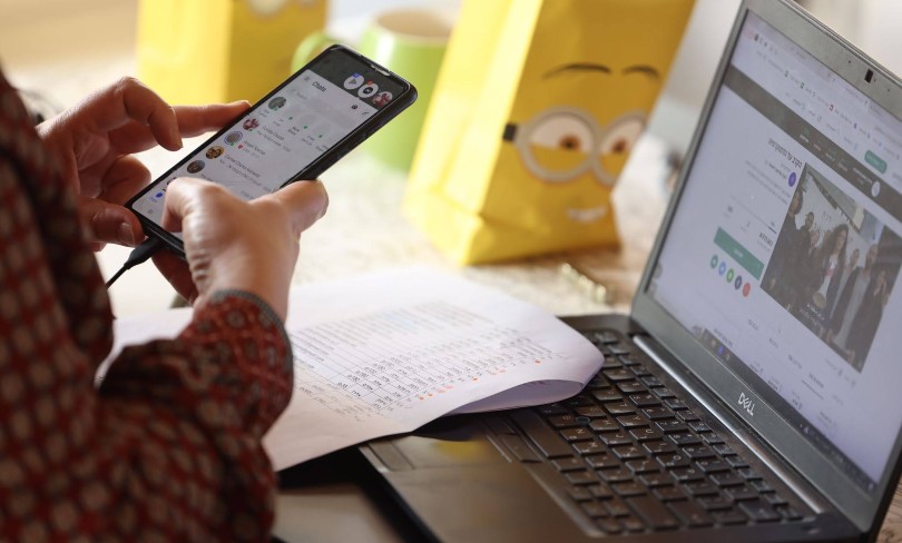 A FakeReporter researcher at their computer