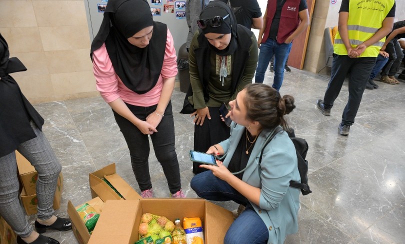 Volunteers organizing supplies at the Jewish-Arab center