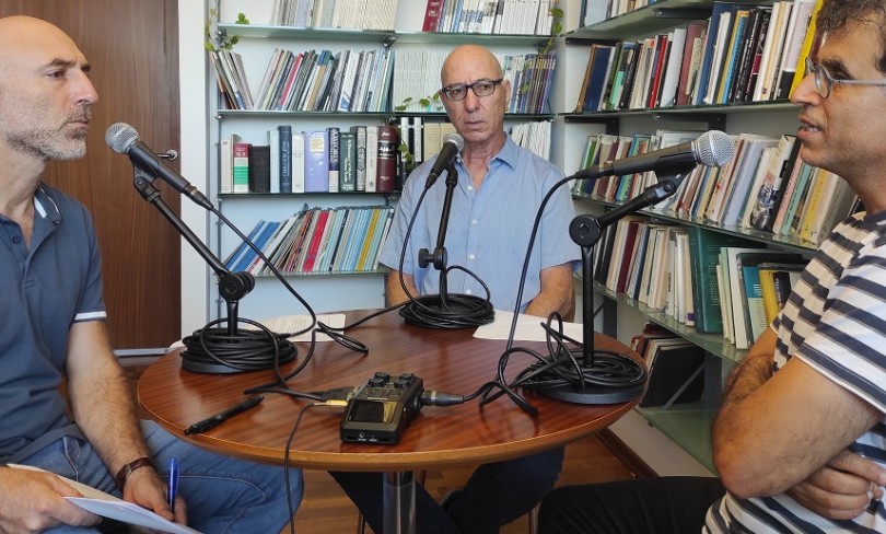 Three men recording a podcast