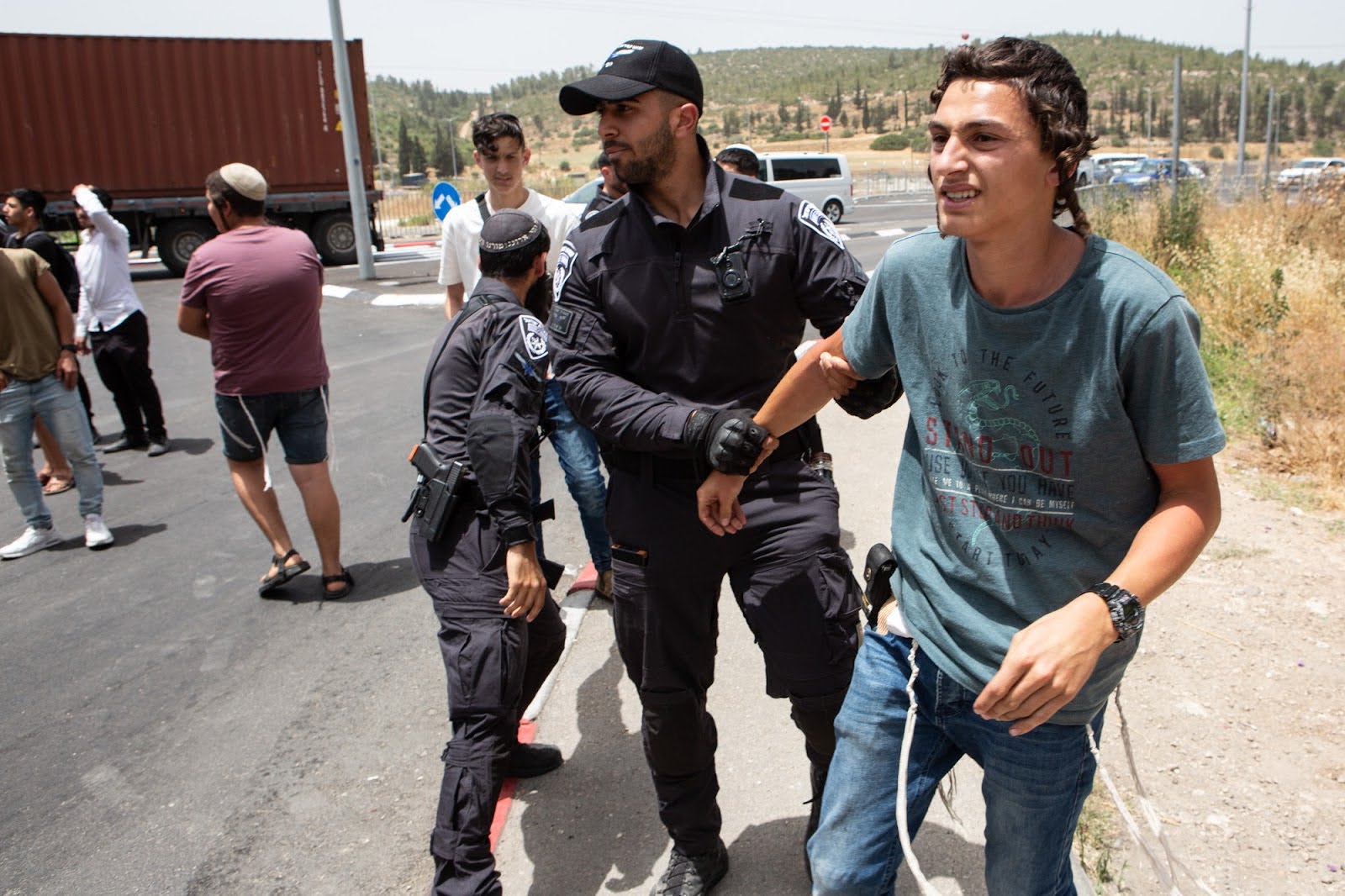 Humanitarian Guard 7 a right-wing activist is escorted away by police