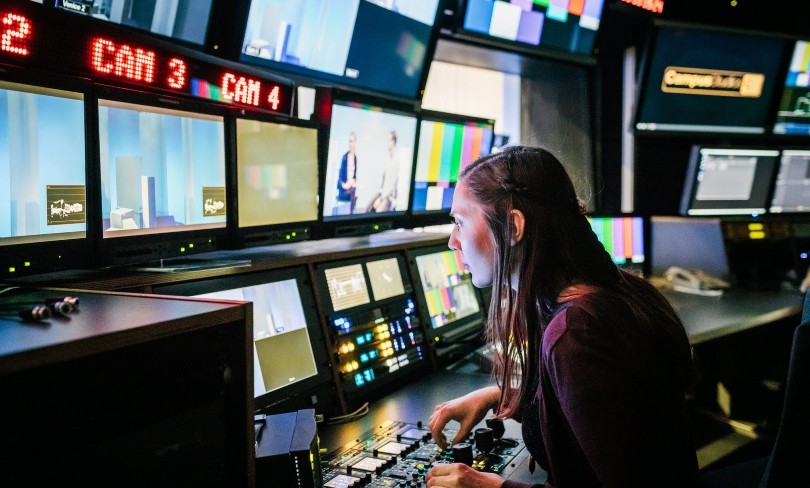 Woman in media editing room