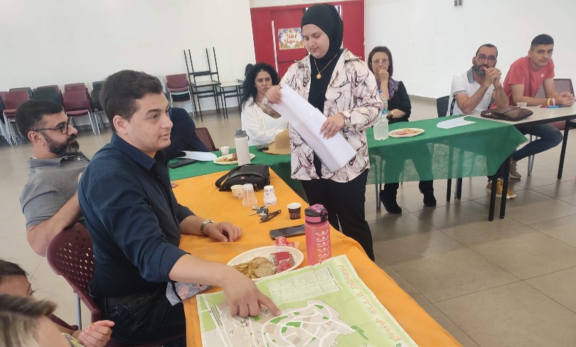 Arab activists looking at a map