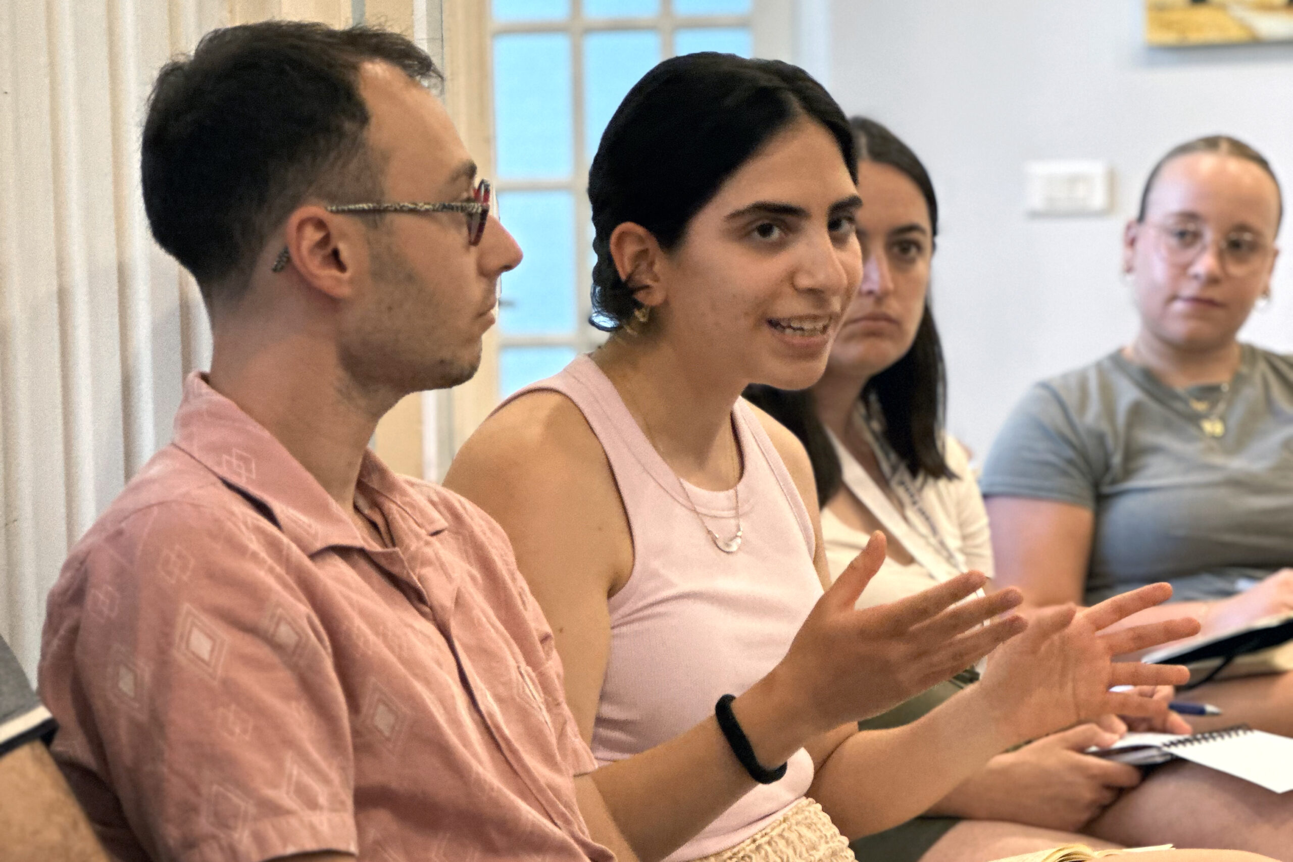Ainav Rabinowitz asks a question during a panel discussion