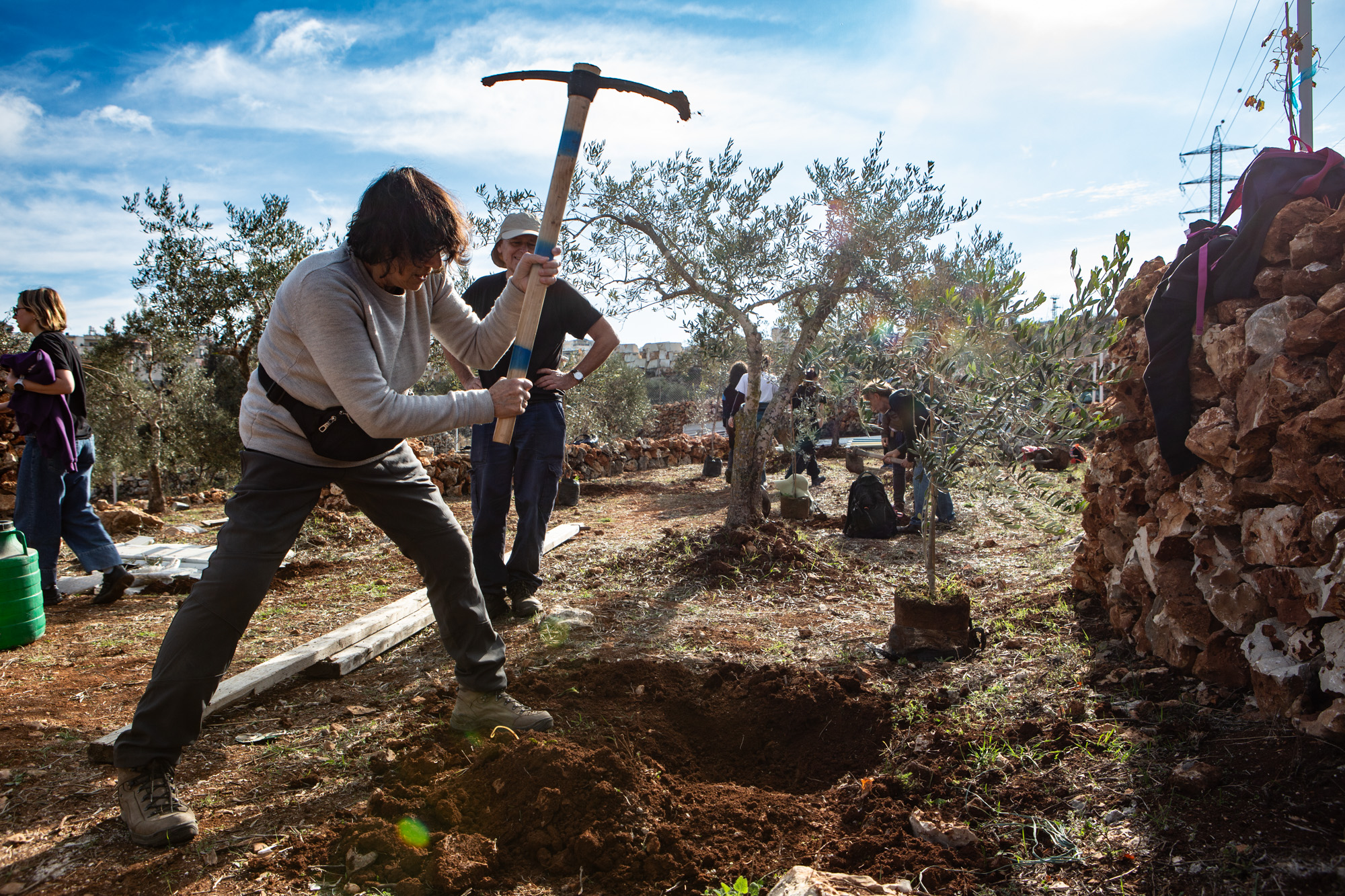 An RHR volunteer digging