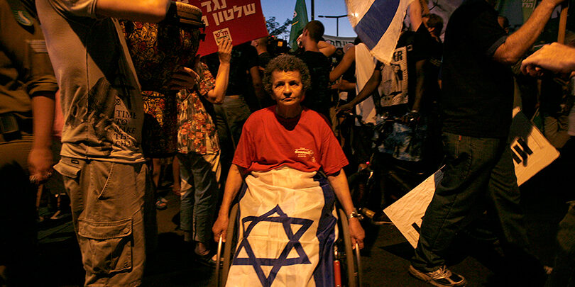 WomanInRedWithFlag_SEJ_featured